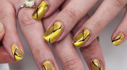 Elegant gold nail art at Royal Nails & Beauty Kelston, Auckland, Auckland, NZ, showcasing intricate designs.