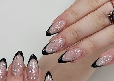 Stylish black-tipped nails with glitter at Royal Nails & Beauty Kelston, Auckland, Auckland, NZ.