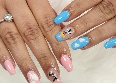 Stylish cartoon nail art at Royal Nails & Beauty Kelston, Auckland, NZ, showcasing vibrant designs and colors.