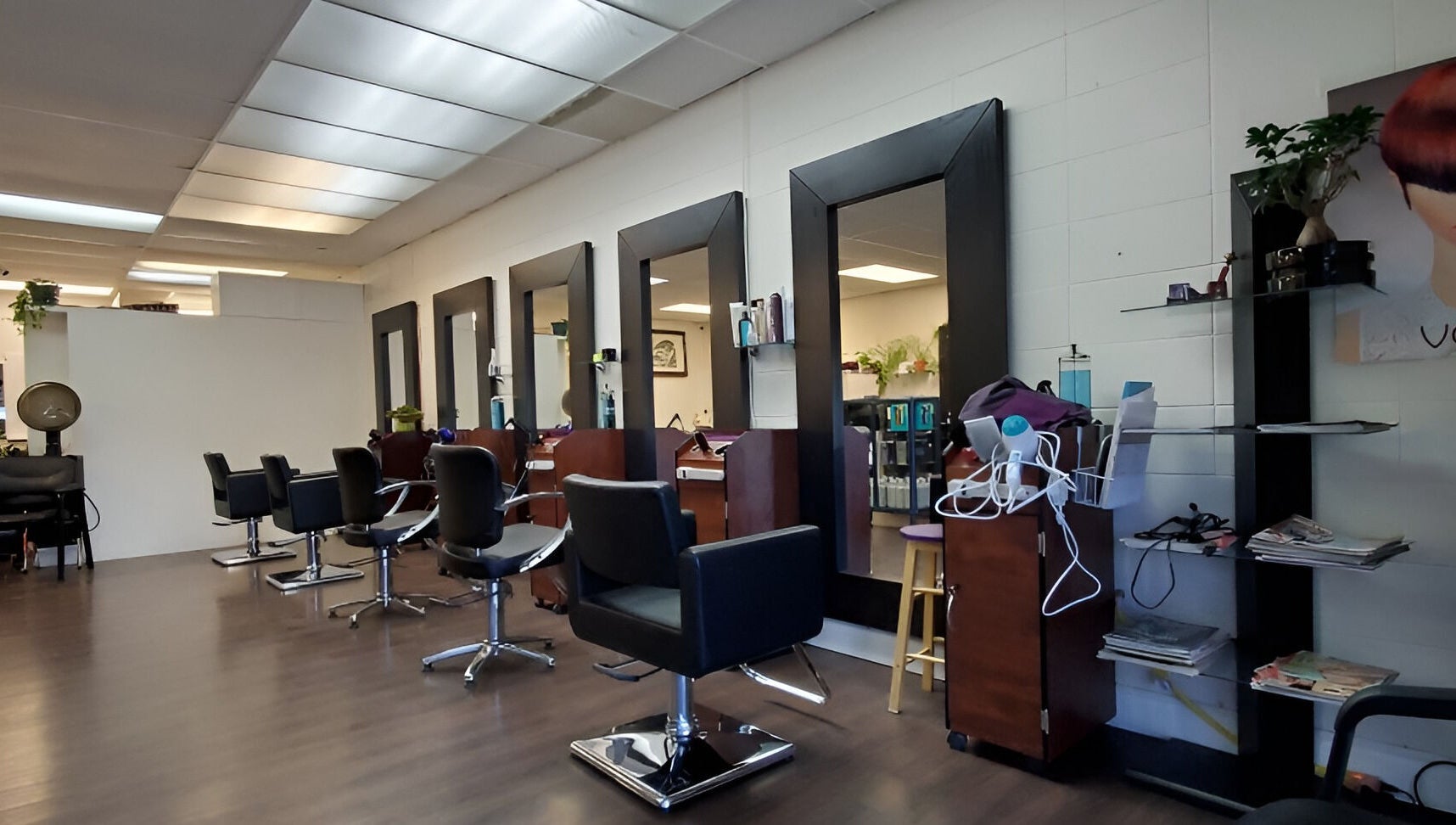 Modern interior of Purple Jade Hair Design, Calgary, Alberta, CA with sleek styling stations.