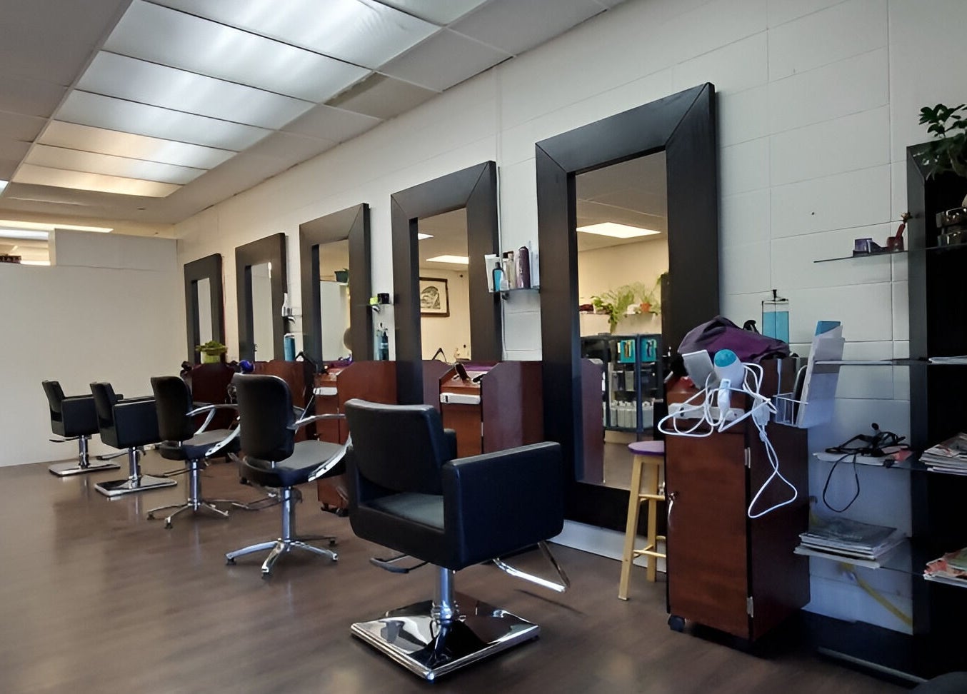 Modern interior of Purple Jade Hair Design, Calgary, Alberta, CA with sleek styling stations.