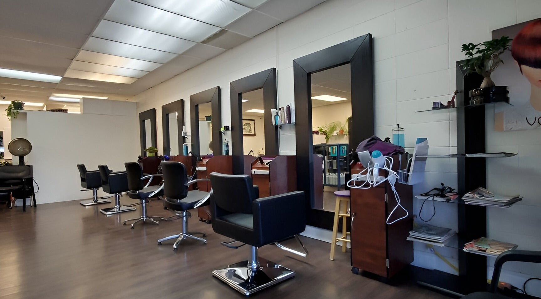 Modern interior of Purple Jade Hair Design, Calgary, Alberta, CA with sleek styling stations.
