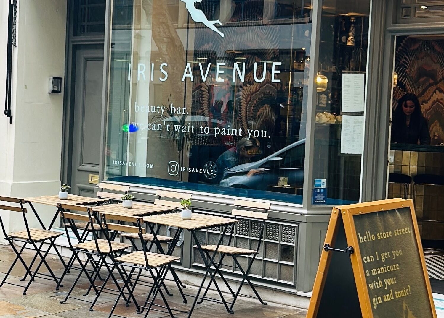 Iris Avenue beauty bar exterior with outdoor seating in London, England, GB.