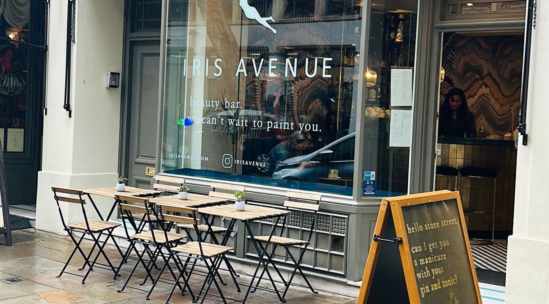 Iris Avenue beauty bar exterior with outdoor seating in London, England, GB.