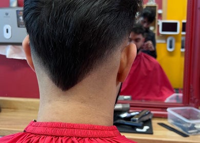 A close-up of a stylish haircut at Soorya Barbers in Harrow, England, GB showcasing expert barber skills.