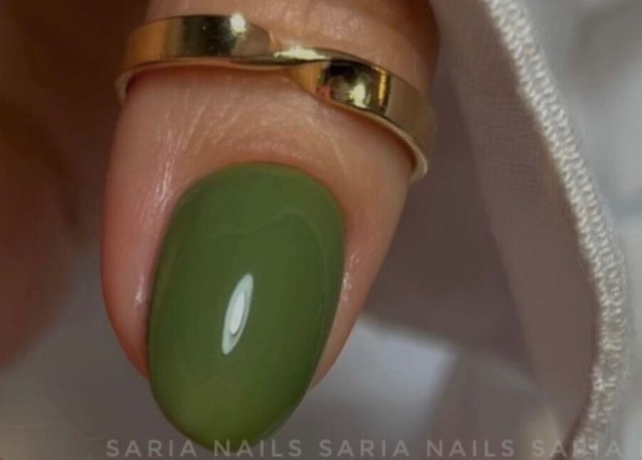 Close-up of a hand with emerald green nail polish at Saidi Nails, Limassol, Limassol, CY.