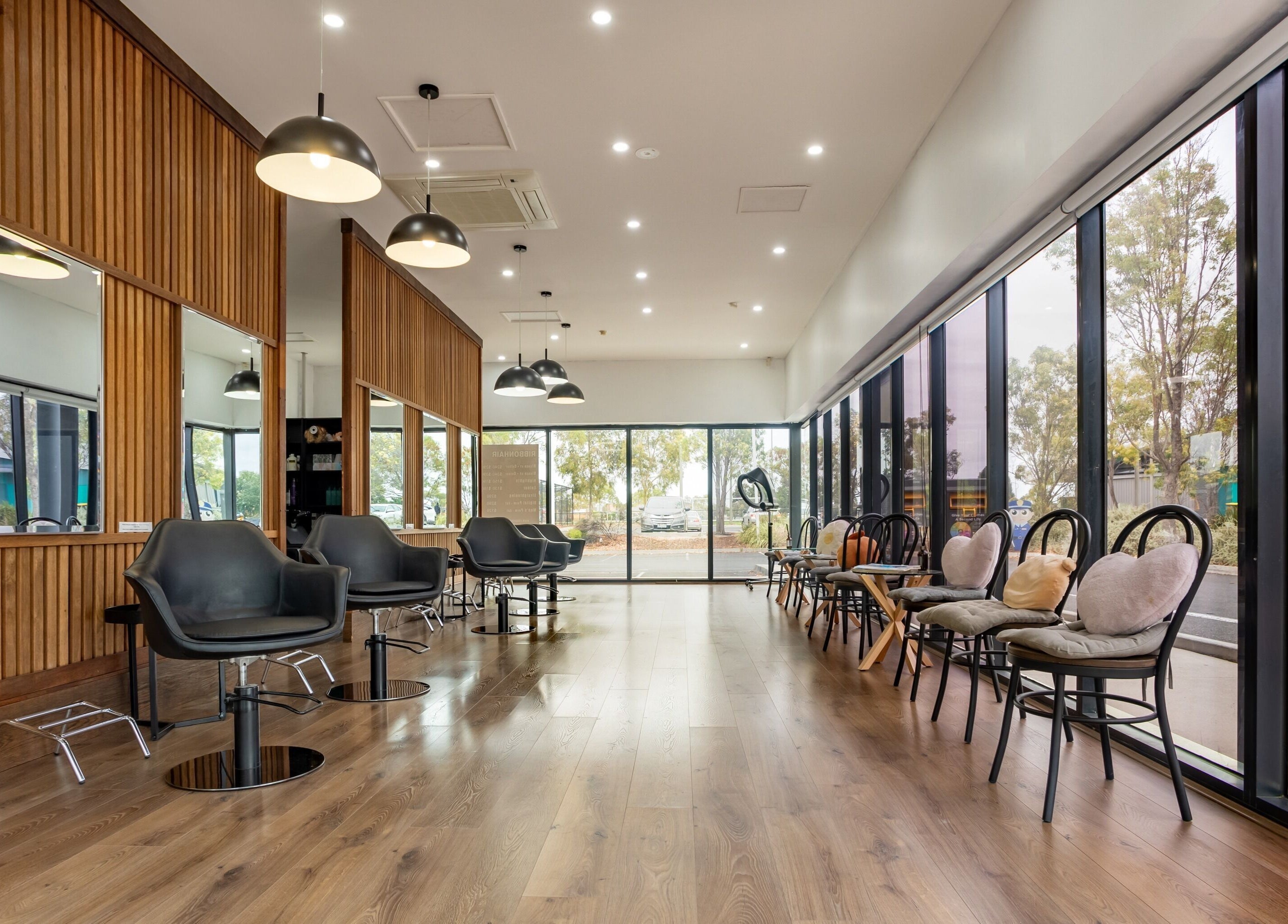 Sleek interior of Ribbon Hair - Point Cook, Melbourne, Victoria, AU showcasing modern salon design.