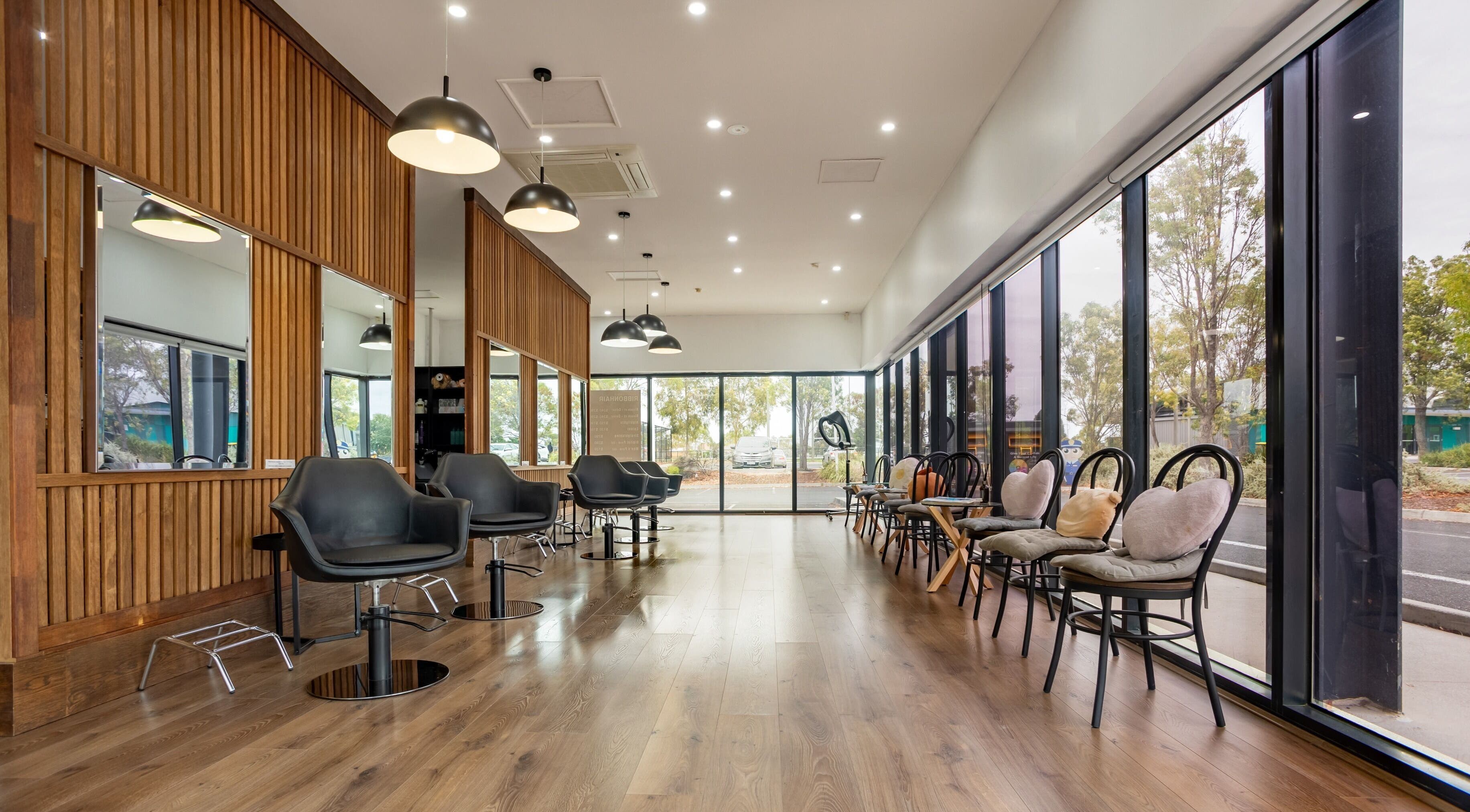 Sleek interior of Ribbon Hair - Point Cook, Melbourne, Victoria, AU showcasing modern salon design.