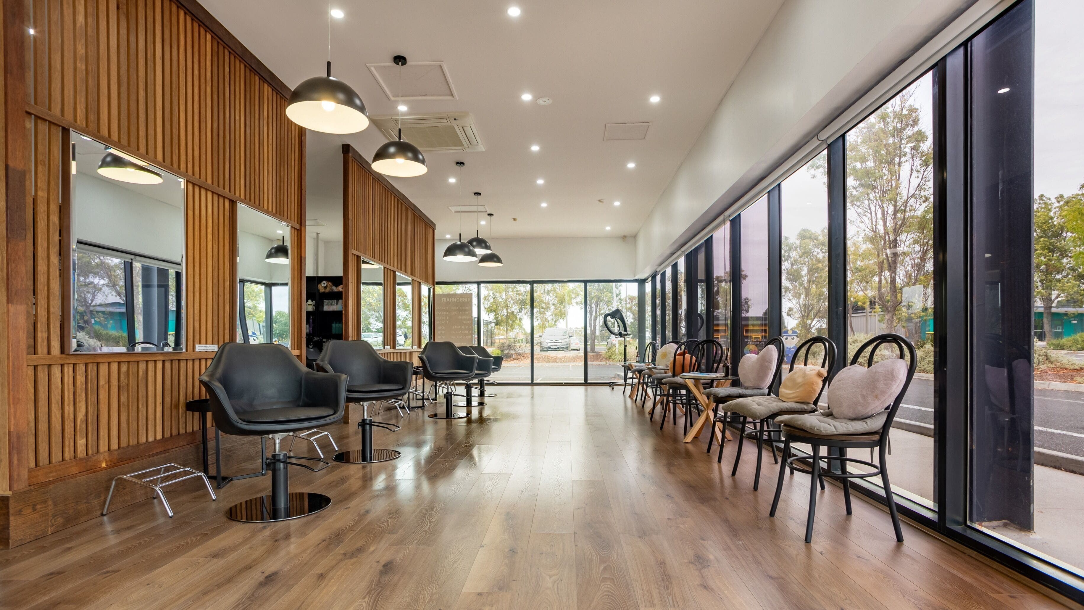 Sleek interior of Ribbon Hair - Point Cook, Melbourne, Victoria, AU showcasing modern salon design.