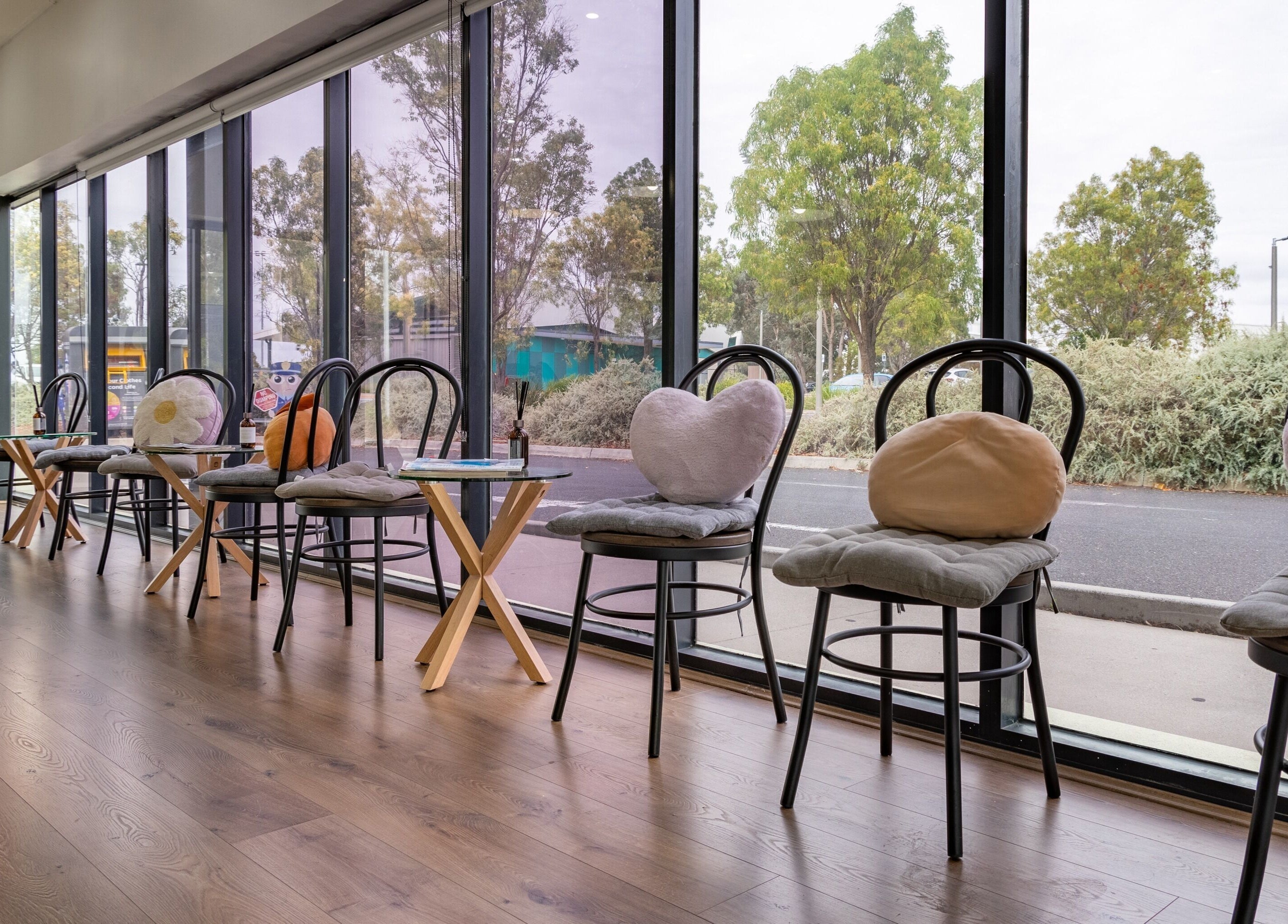 Comfortable seating area with cushioned chairs at Ribbon Hair - Point Cook, Melbourne, Victoria, AU.