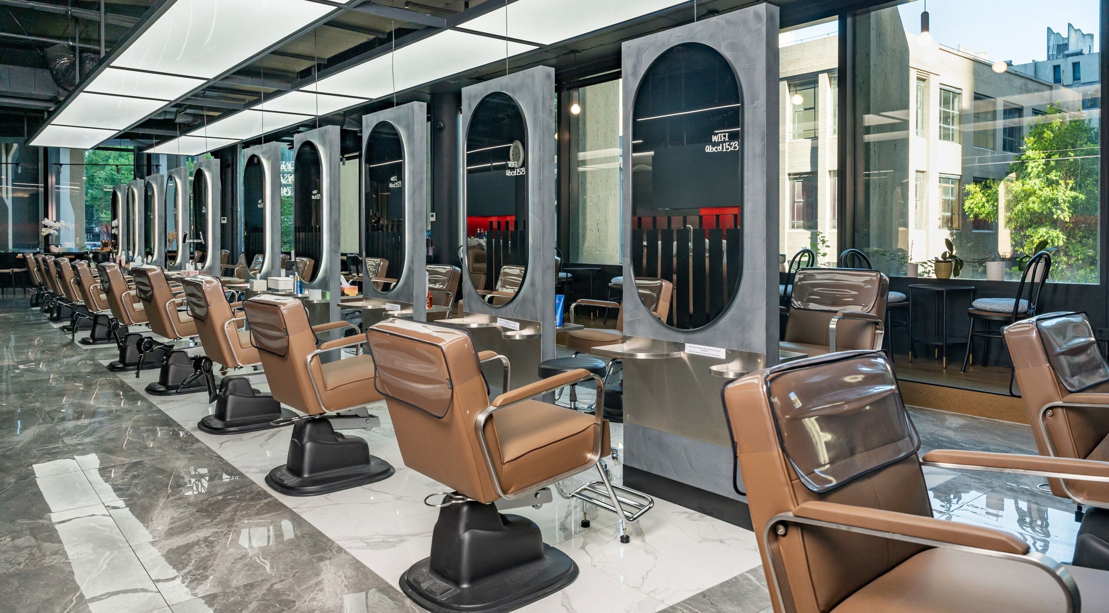 Modern salon chairs and mirrors at Ribbon Hair Queens Place - 370 Queen st., Melbourne, Victoria, AU.