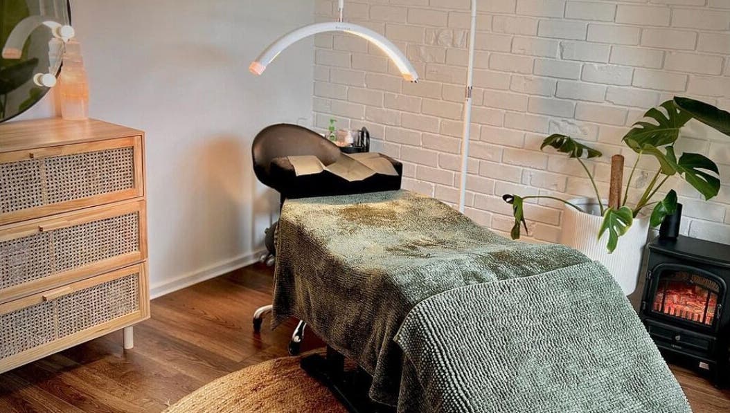 Relaxing spa room at The Beauty Nook, Melbourne, Victoria, AU, with comfy bed and soothing decor.