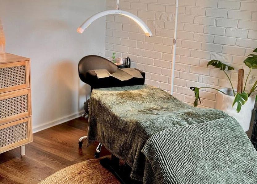 Relaxing spa room at The Beauty Nook, Melbourne, Victoria, AU, with comfy bed and soothing decor.