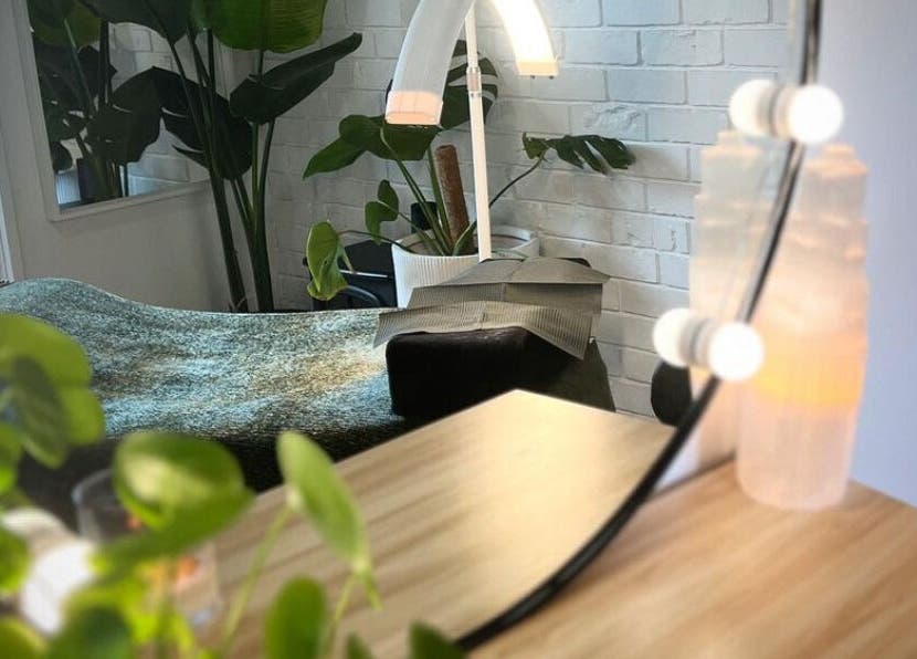 Cozy corner at The Beauty Nook, Melbourne, Victoria, AU with plants and ambient lighting.