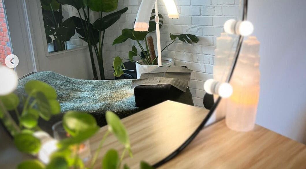 Cozy corner at The Beauty Nook, Melbourne, Victoria, AU with plants and ambient lighting.