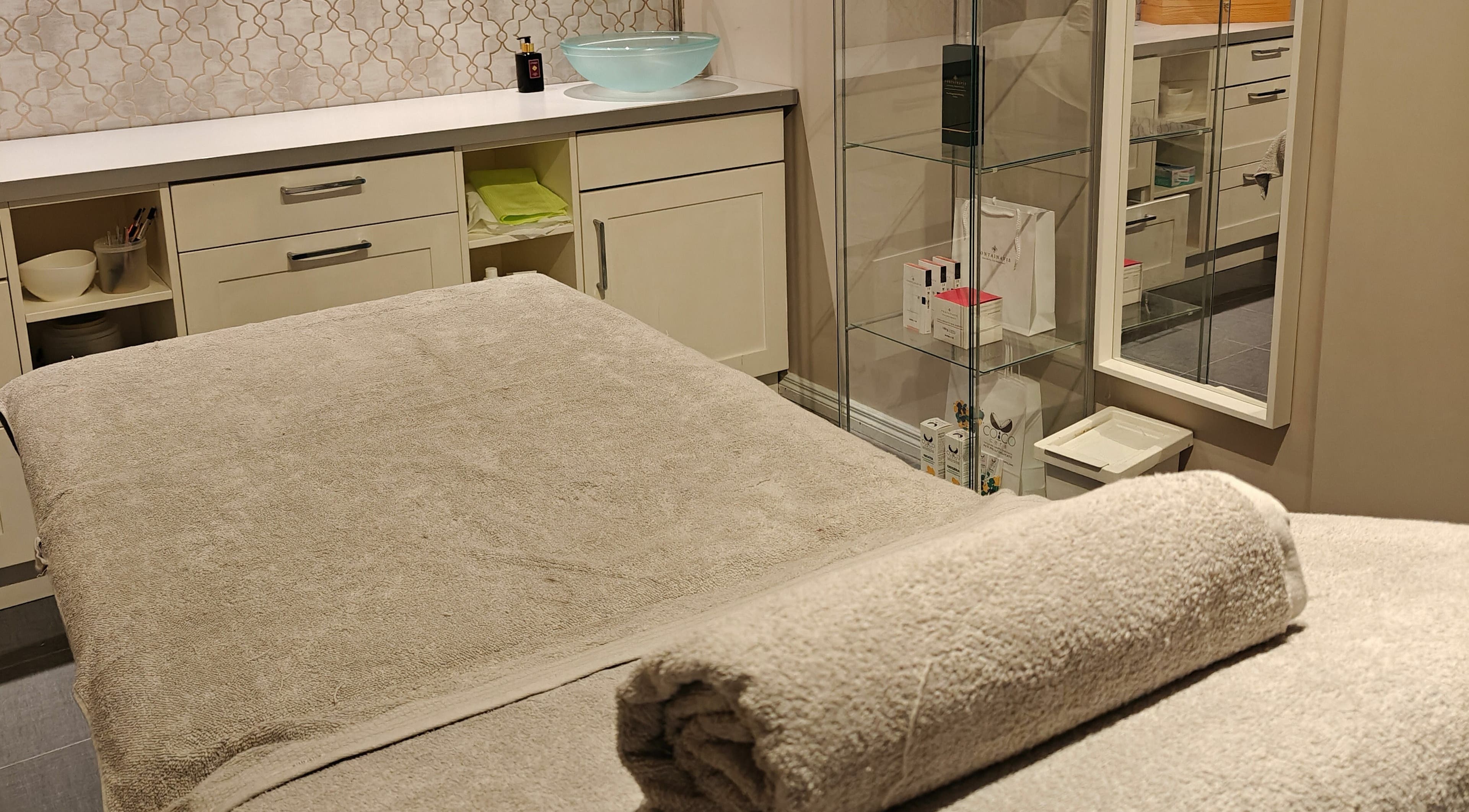 Relaxing treatment room at Sunbar Hair & Beauty Ltd. Tuam, County Galway, IE with a plush massage table.