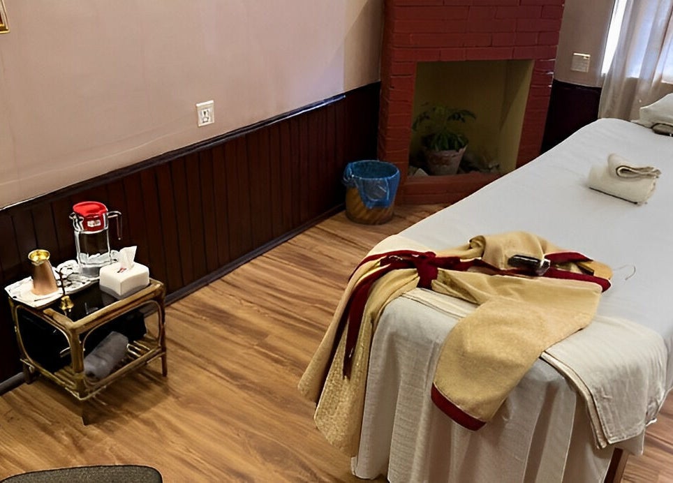 Relaxing spa room at Chaitanya Health & Wellness Pvt. Ltd., Lalitpur, Bagmati Province, NP with a massage table and towels.