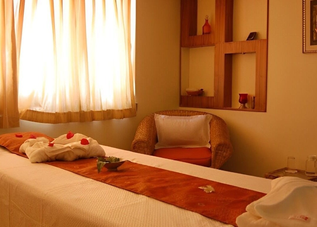 Relaxing massage room at Chaitanya Health & Wellness Pvt. Ltd., Lalitpur, Bagmati Province, NP with soft lighting.
