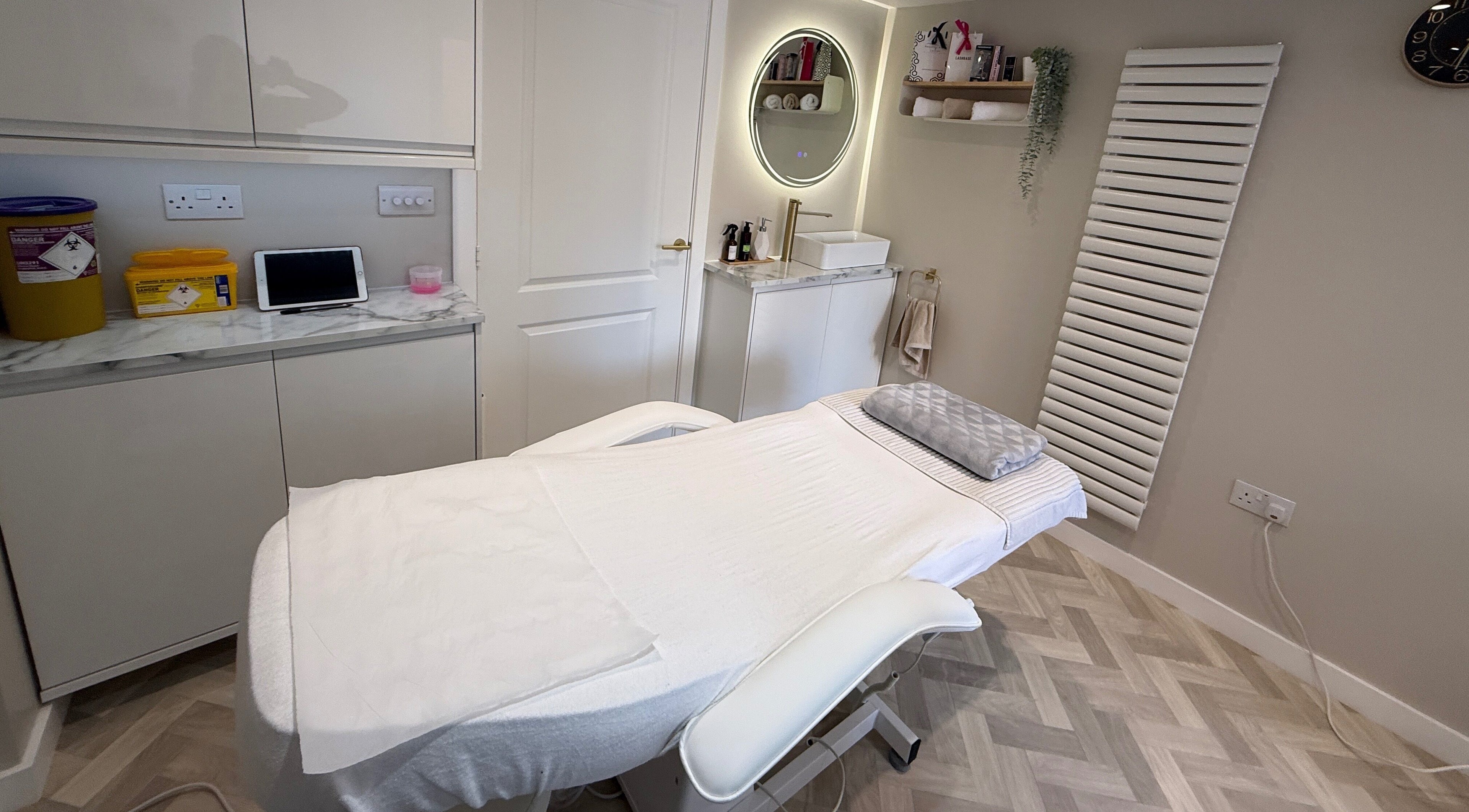 Treatment room at Plush Beauty Box in Exeter, England, GB with modern decor and a comfortable bed.