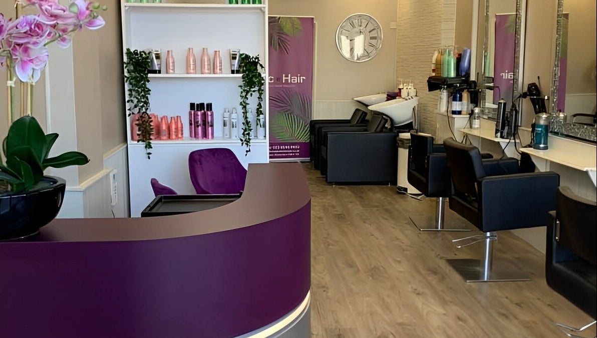 Interior of Mac Hair salon, Southampton, England with modern decor, styling chairs and vibrant product displays.
