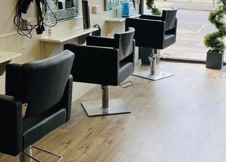 Modern salon chairs at Mac Hair, Southampton, England, GB, offering comfort and style for beauty treatments.