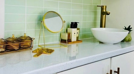 Elegant vanity at Emma Rose Aesthetics & Laser Clinic, Bristol, England, GB featuring a mirror and chic decor.