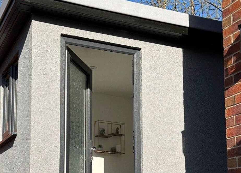 Entrance to Emma Rose Aesthetics & Laser Clinic, Bristol, England, GB, showcasing a modern exterior in sunlight.