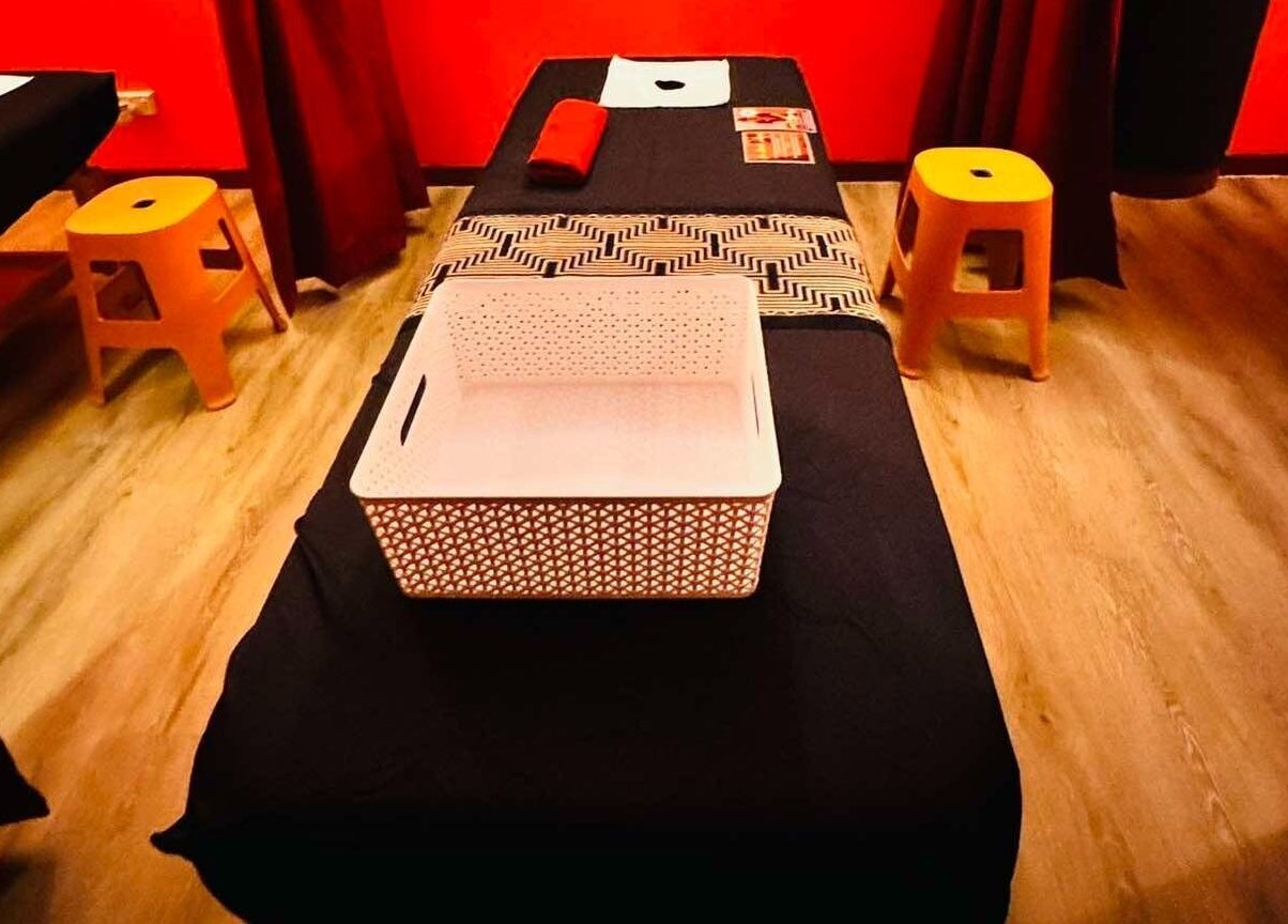 Tranquil massage room at Bamboo Spa Papakura, Auckland. Warm ambiance enhances relaxation.
