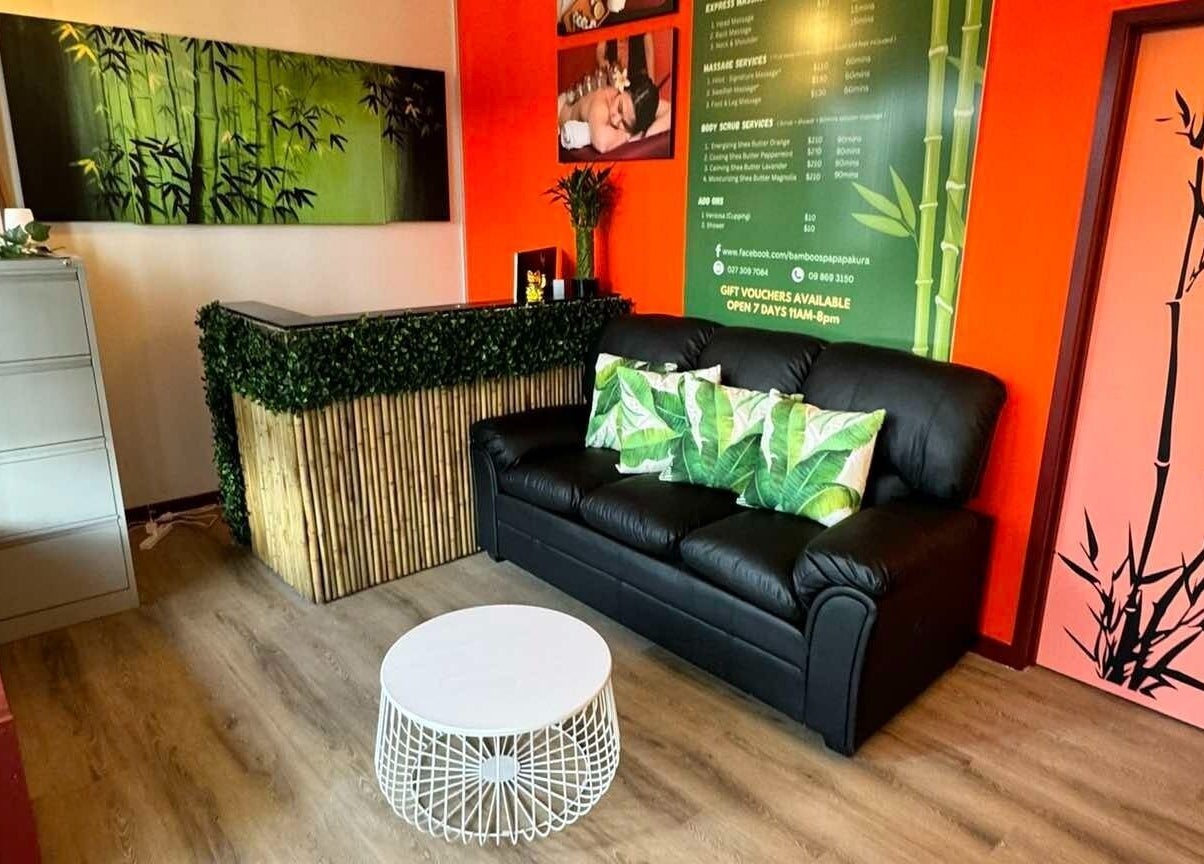 Relaxing lounge at Bamboo Spa Papakura in Auckland, Auckland, NZ with bamboo decor and a cozy sofa.