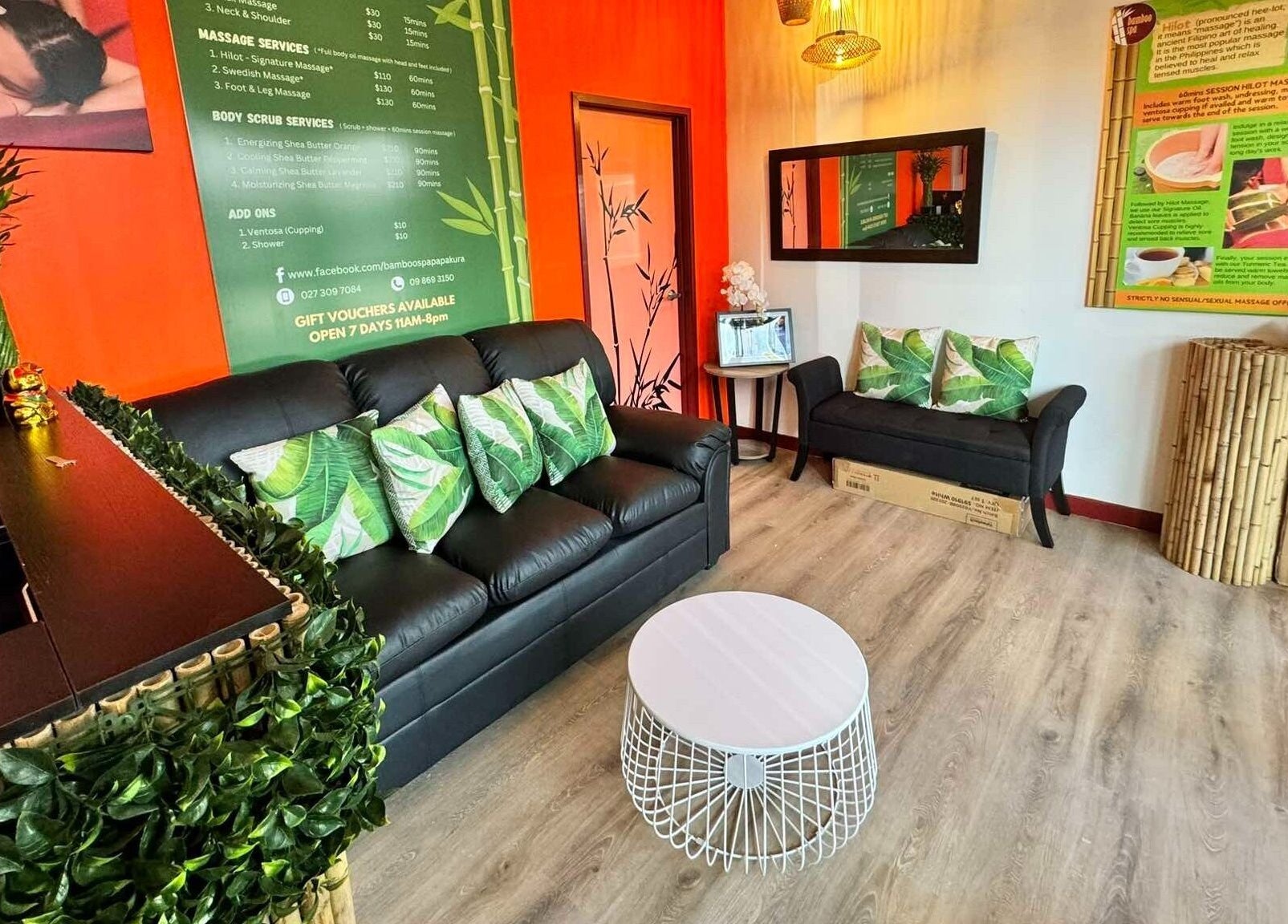 Welcoming reception area of Bamboo Spa Papakura, Auckland, NZ with vibrant decor and comfortable seating.