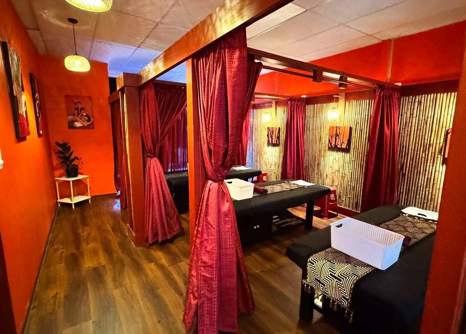 Relaxing massage room at Bamboo Spa Botany, Auckland, Auckland, NZ with warm lighting and elegant decor.