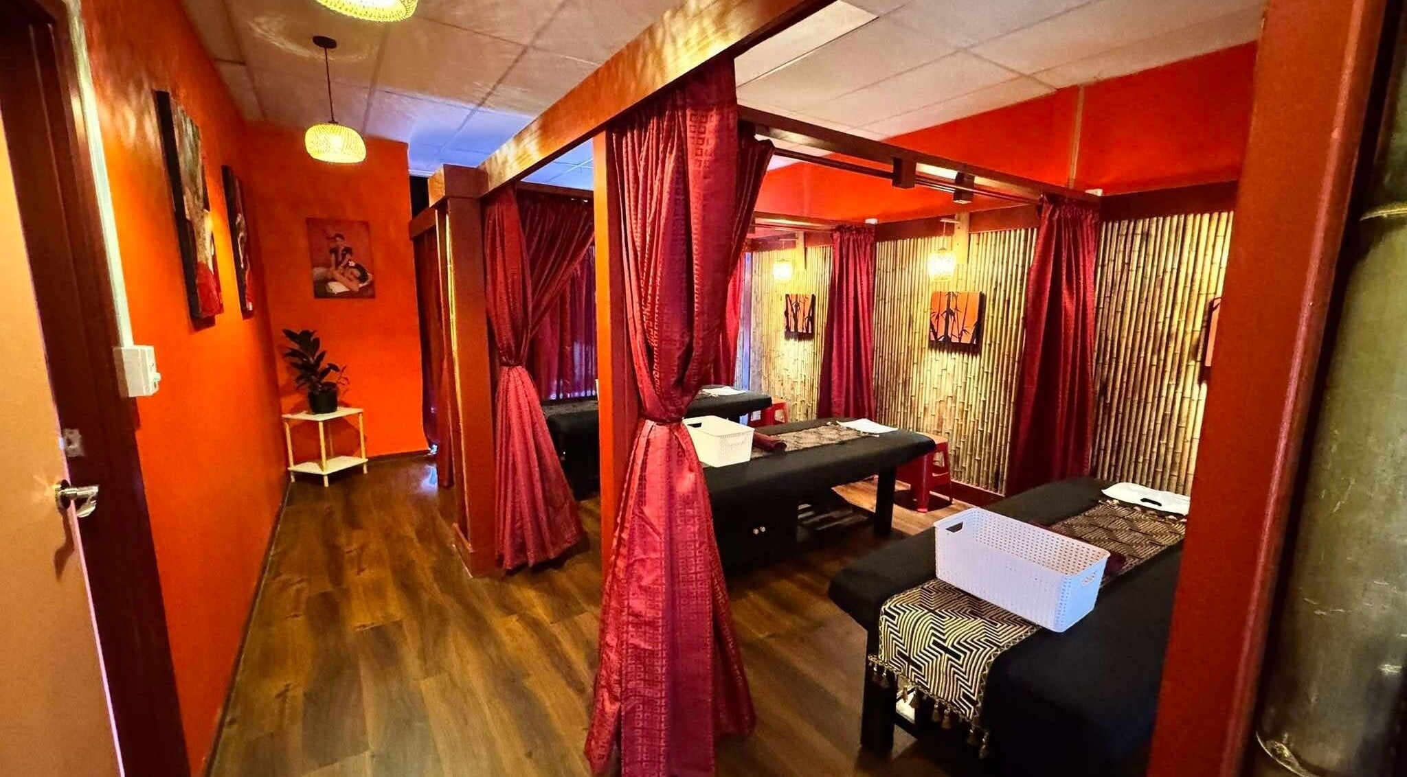 Relaxing massage room at Bamboo Spa Botany, Auckland, Auckland, NZ with warm lighting and elegant decor.