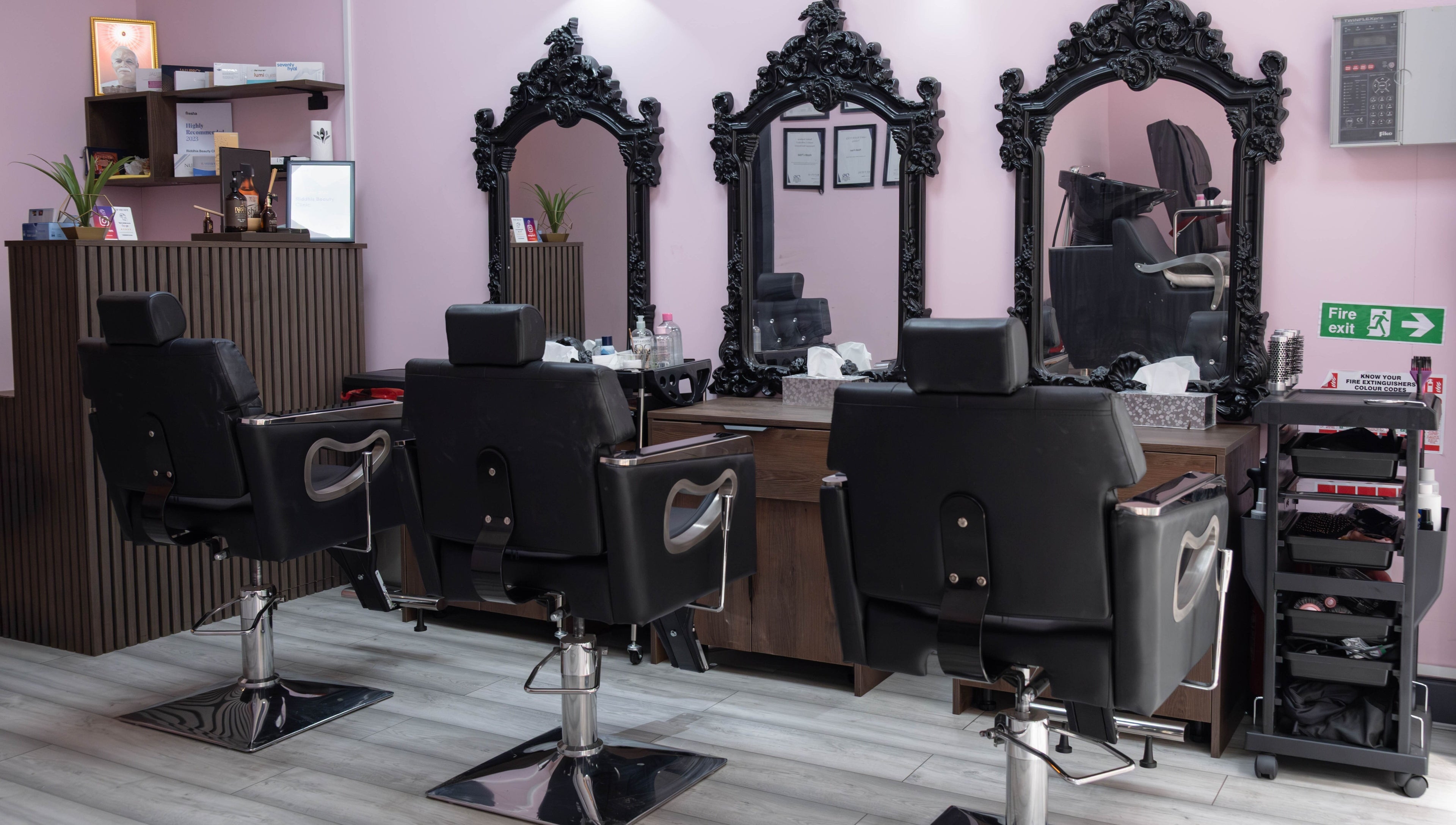 Elegant styling chairs and mirrors inside Riddhis Beauty Clinic, London, England, GB.