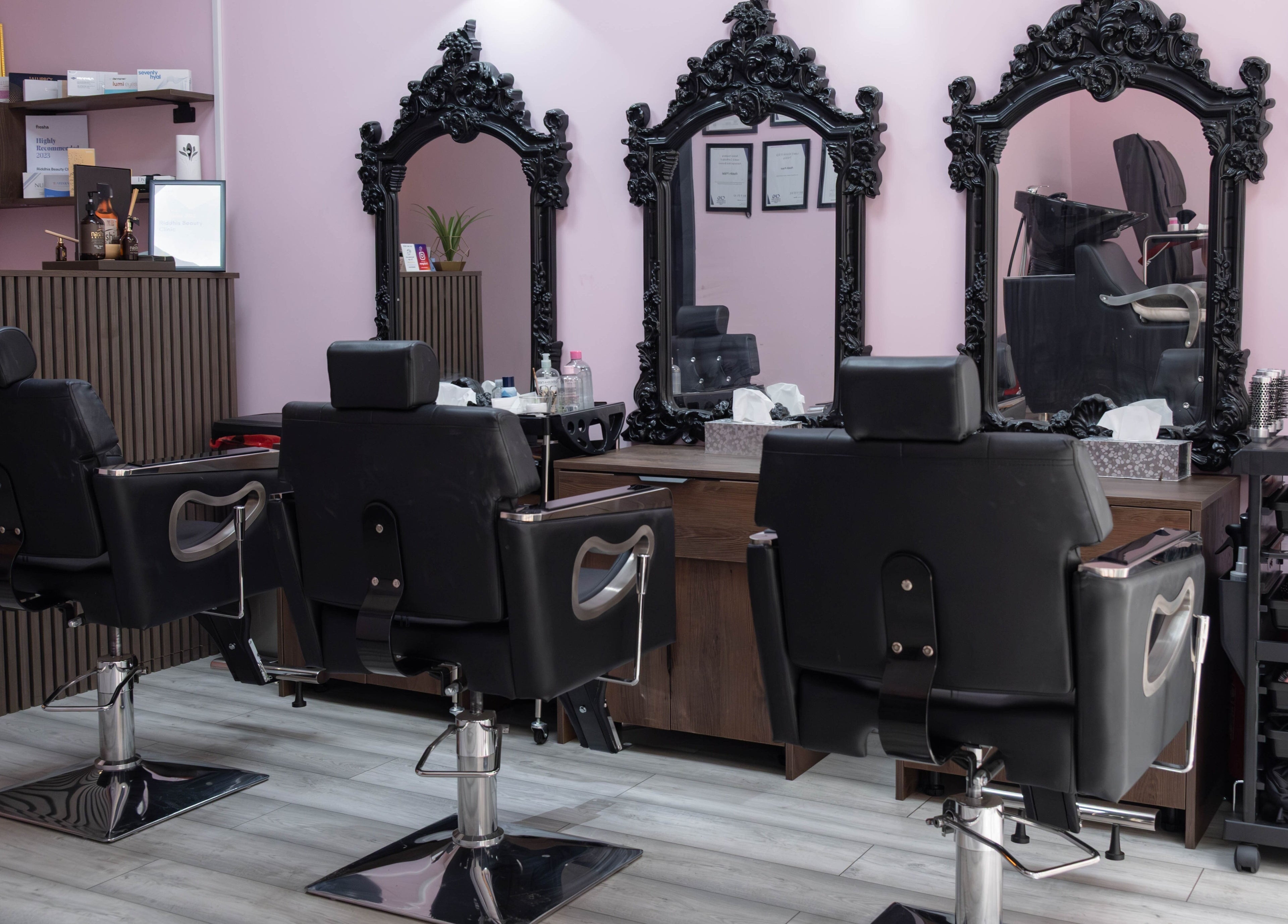Elegant styling chairs and mirrors inside Riddhis Beauty Clinic, London, England, GB.