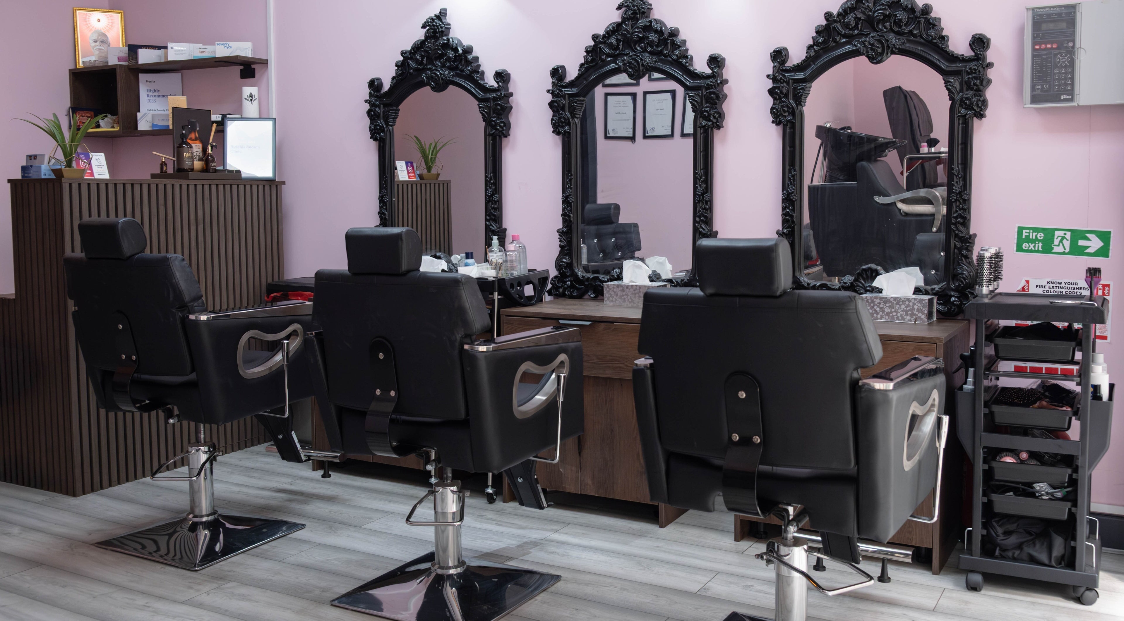 Elegant styling chairs and mirrors inside Riddhis Beauty Clinic, London, England, GB.