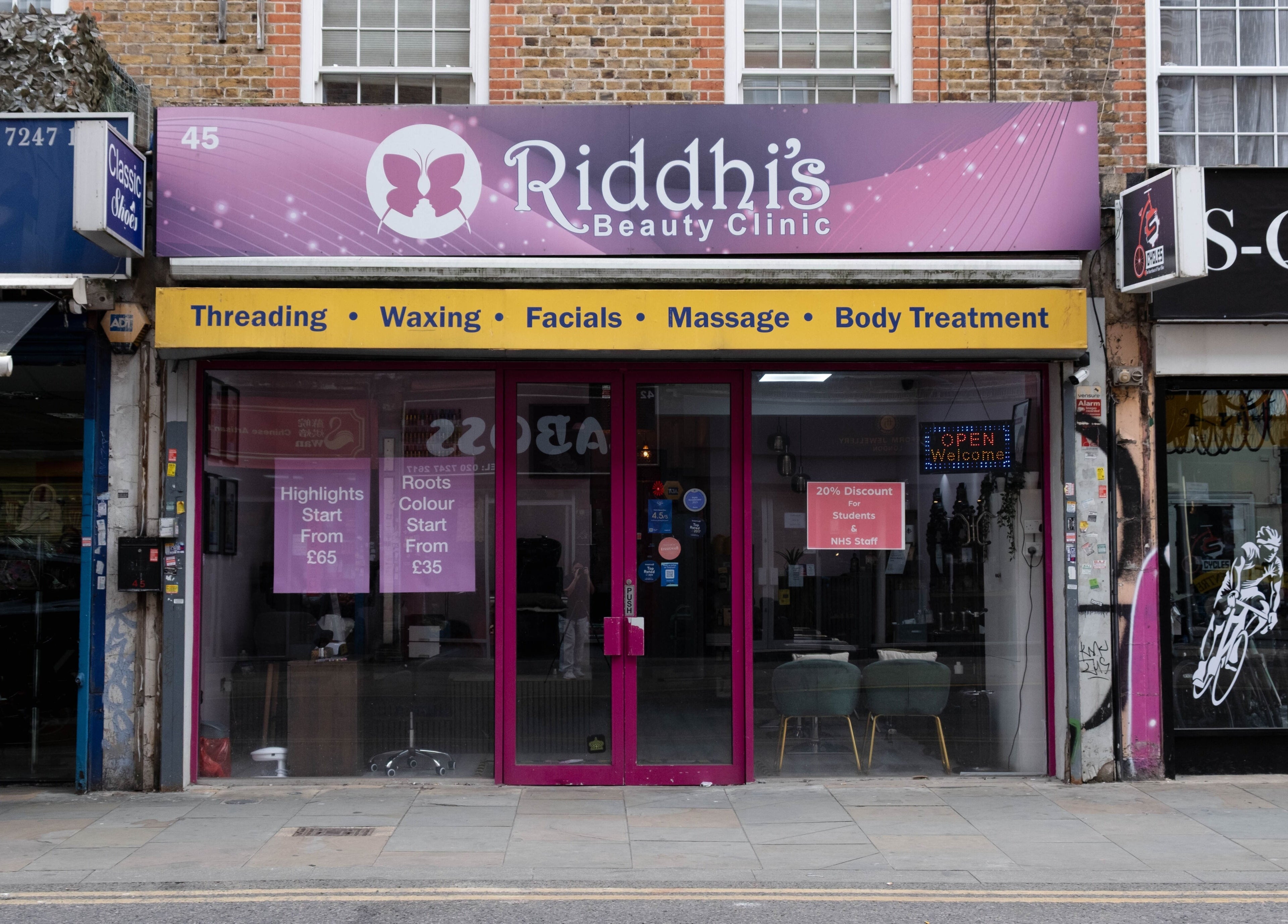 Front view of Riddhis Beauty Clinic in London, England, GB showcasing beauty services signage.