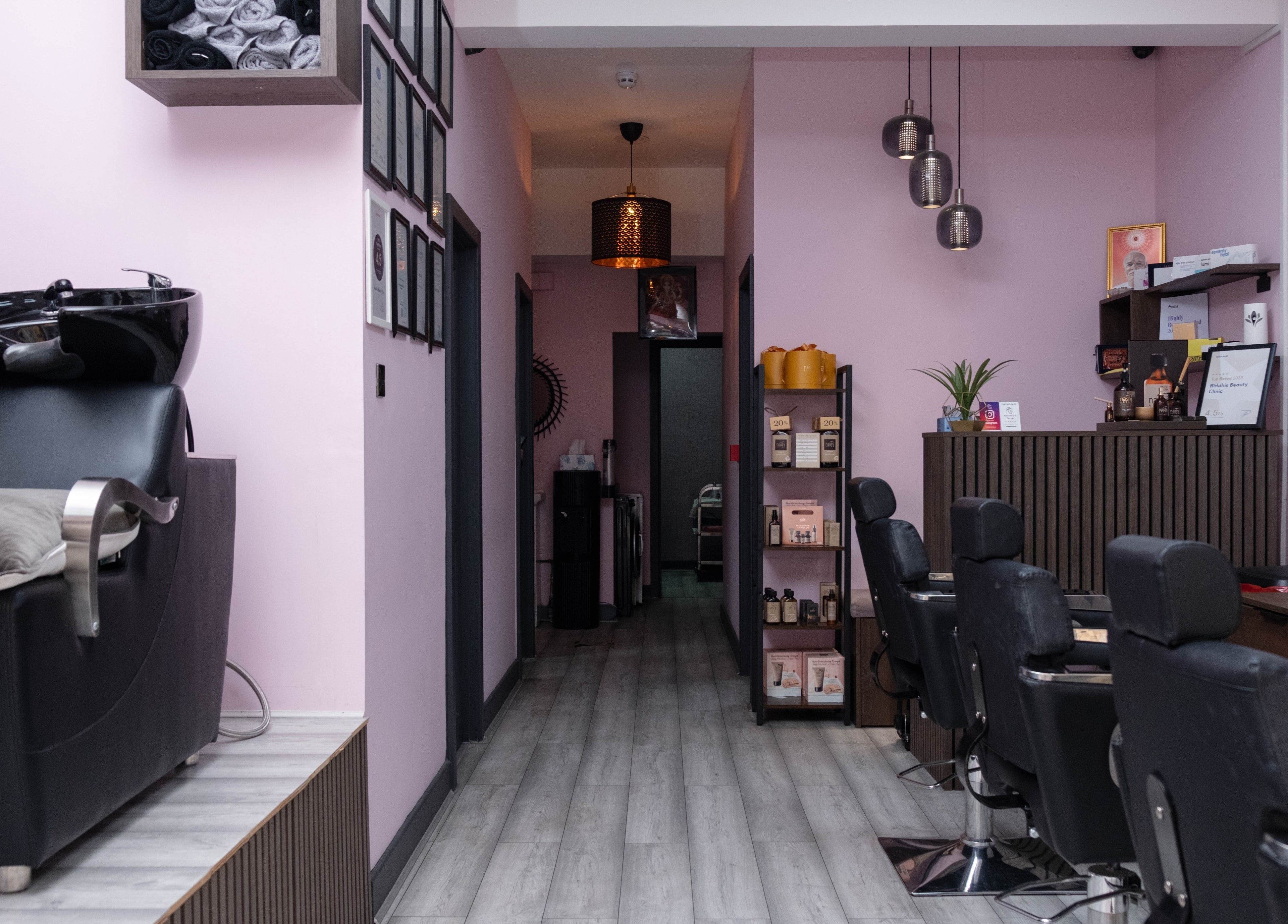Modern salon chairs and wash station at Riddhis Beauty Clinic, London, England, GB.