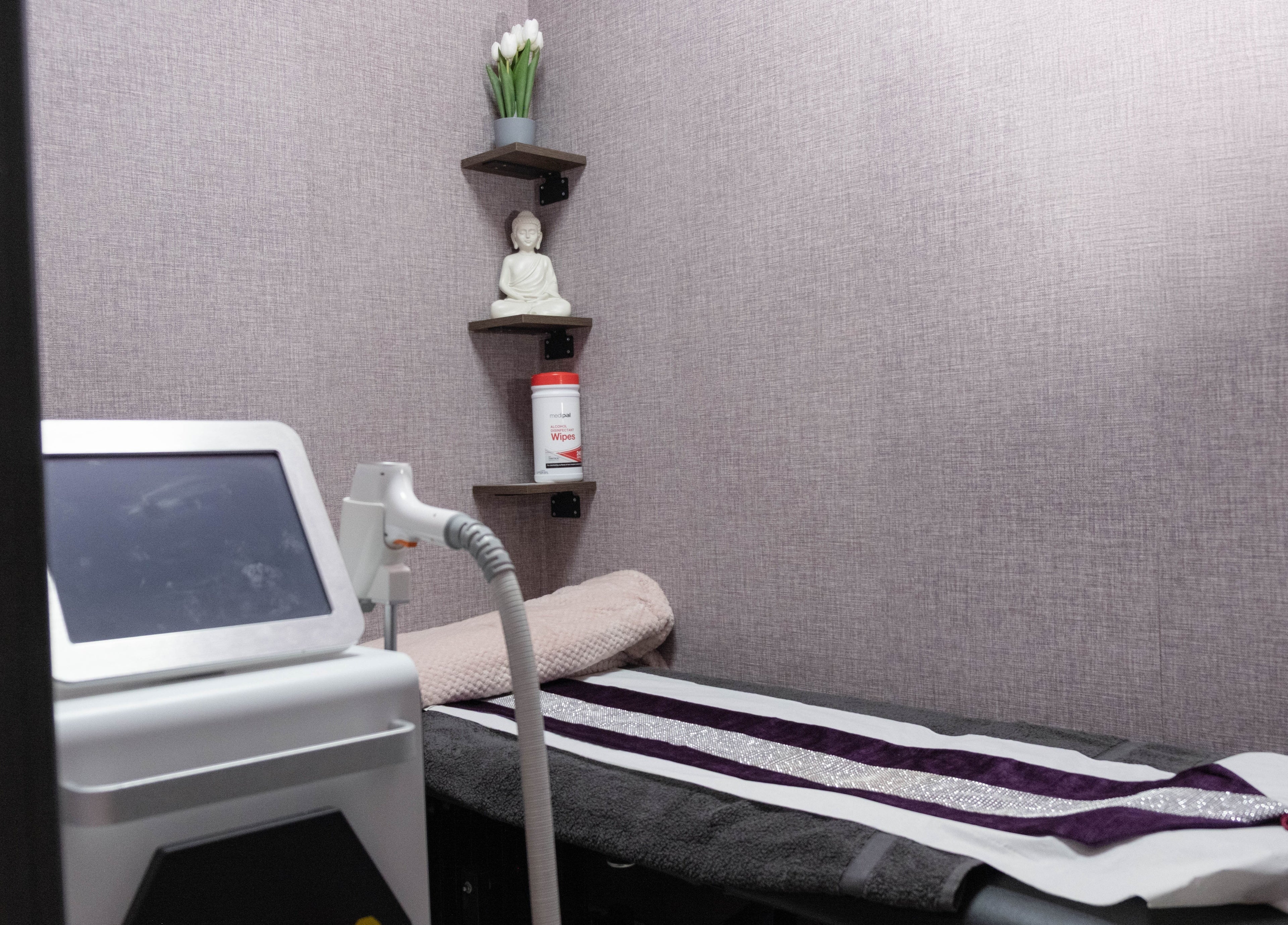 Laser treatment room at Riddhis Beauty Clinic, London, England, GB with relaxing decor and equipment.
