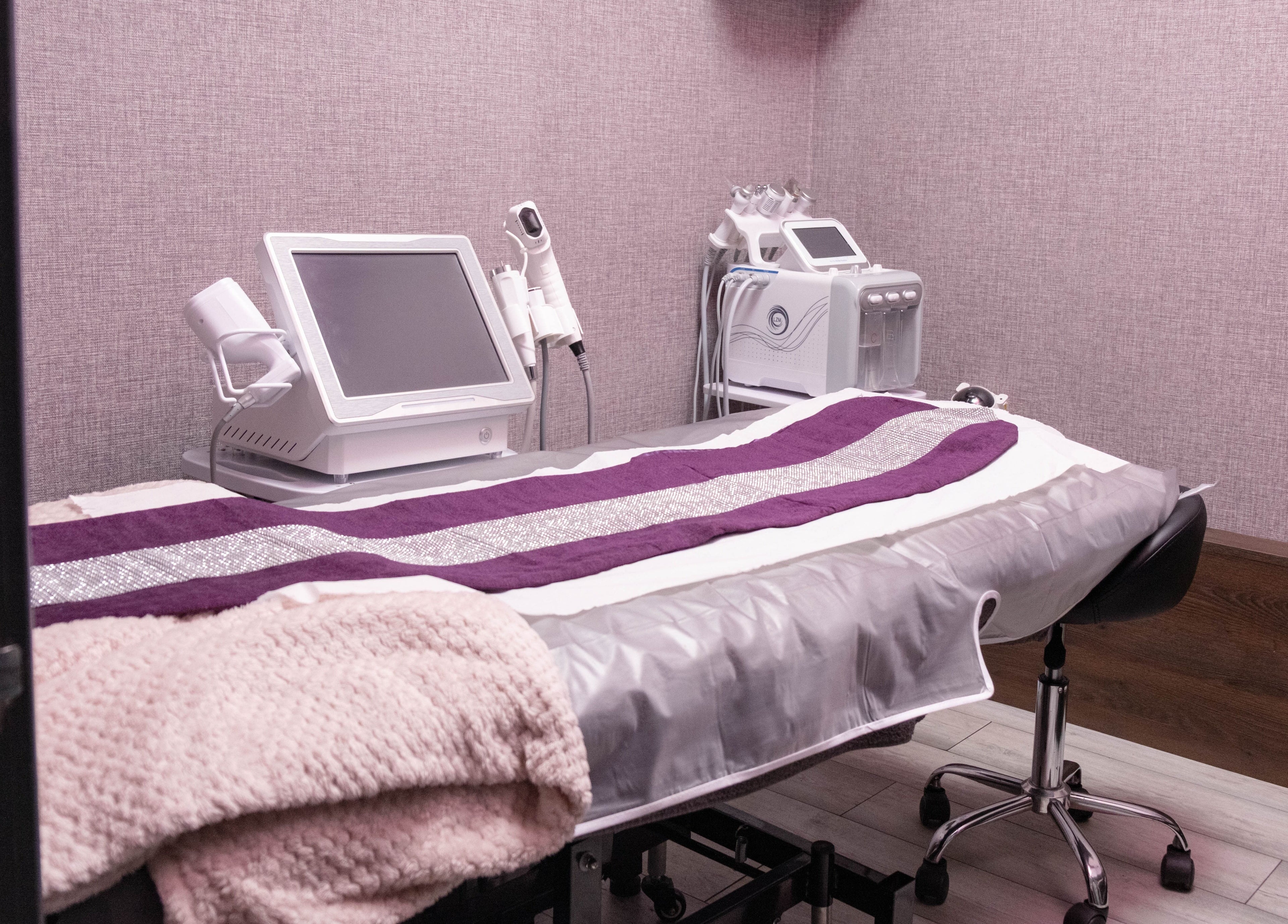 Elegant treatment room at Riddhis Beauty Clinic in London, England, GB with modern equipment and cozy decor.