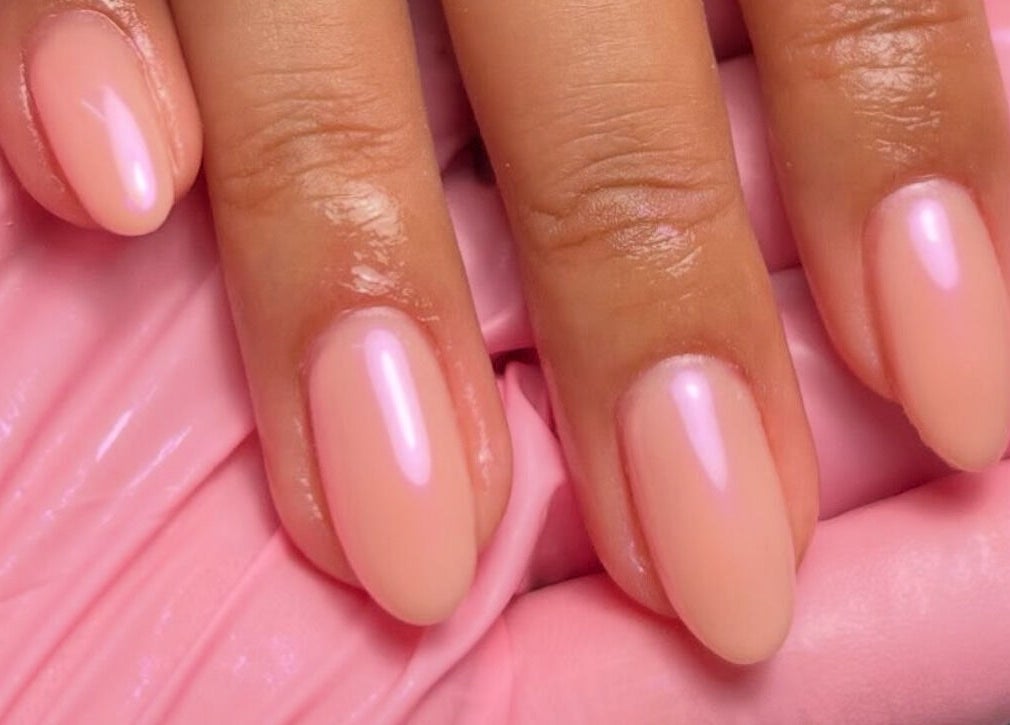 Elegant pink manicure at Nails By Teyah B, Manchester, England, GB, showcasing glossy almond-shaped nails.