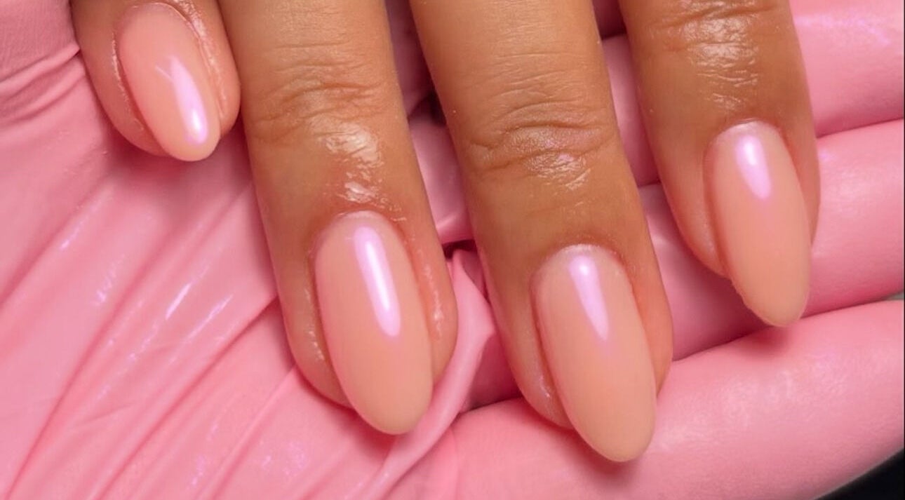 Elegant pink manicure at Nails By Teyah B, Manchester, England, GB, showcasing glossy almond-shaped nails.