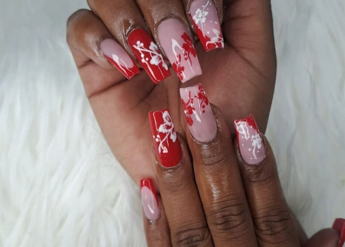 Elegant red and nude floral nail art at Pedie Beauty loop street (ginger hair studio), Cape Town, Western Cape, ZA.