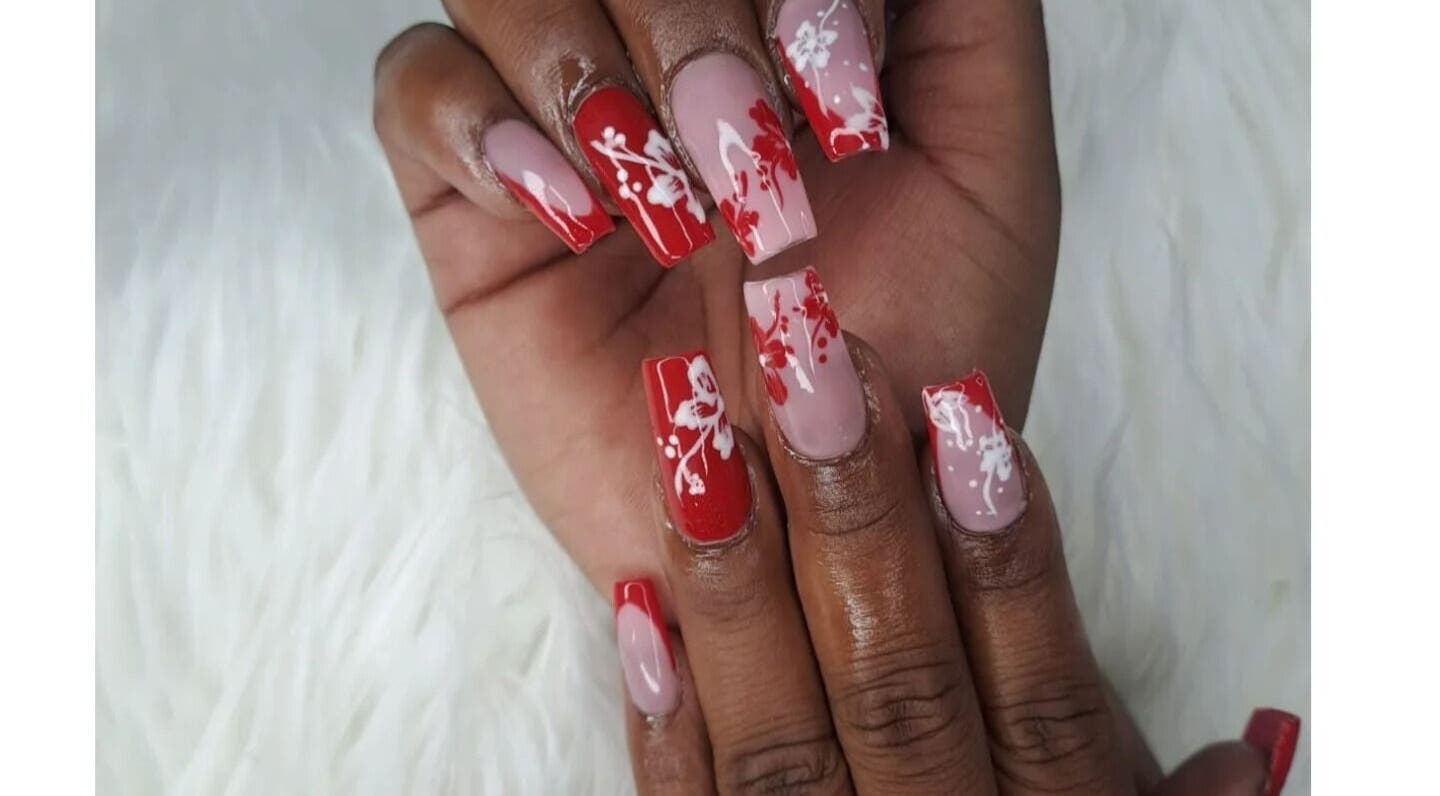 Elegant red and nude floral nail art at Pedie Beauty loop street (ginger hair studio), Cape Town, Western Cape, ZA.
