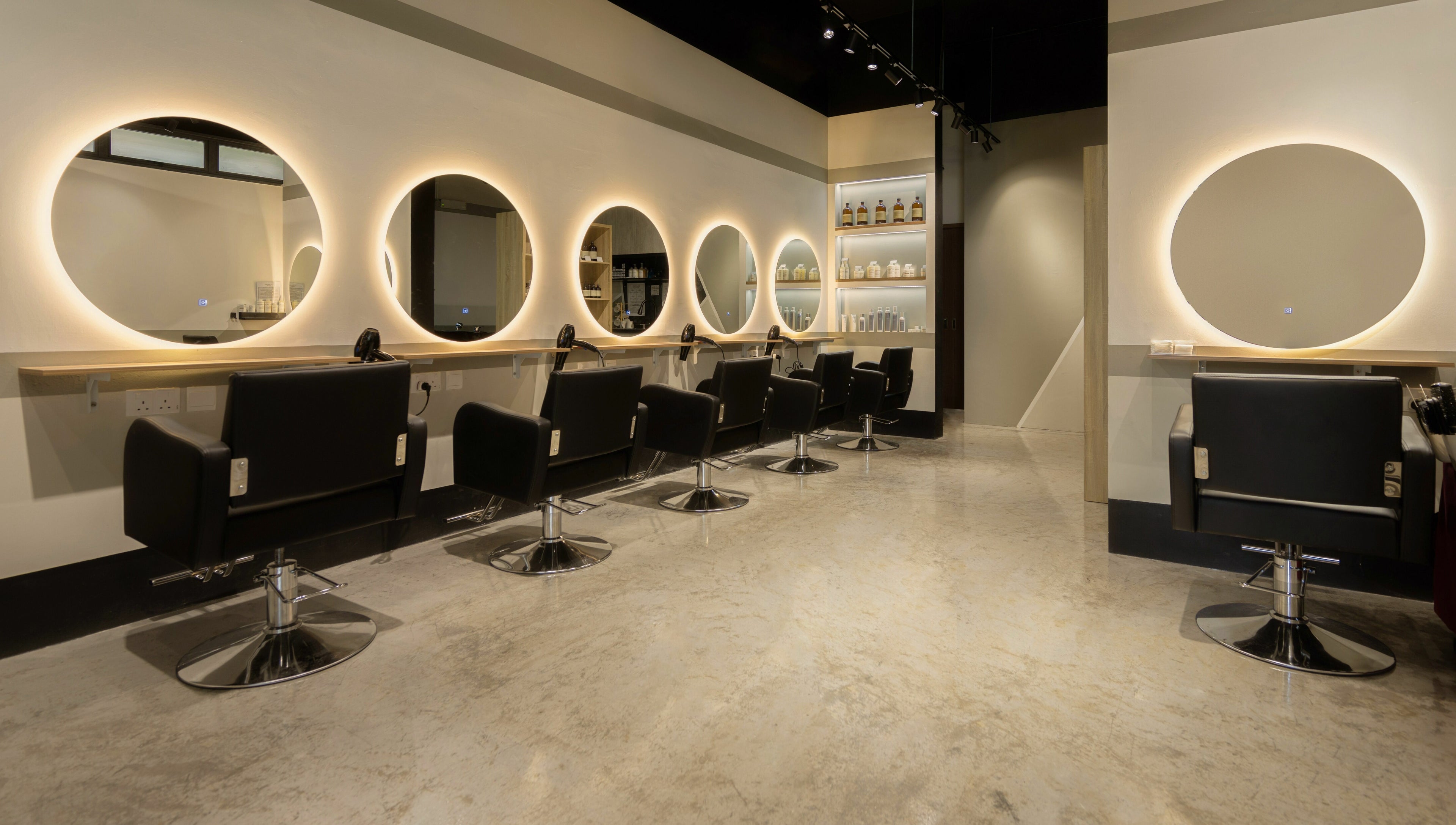 Modern salon chairs and mirrors at Hair by Common Studio - Queenstown, Singapore, Singapore, SG.