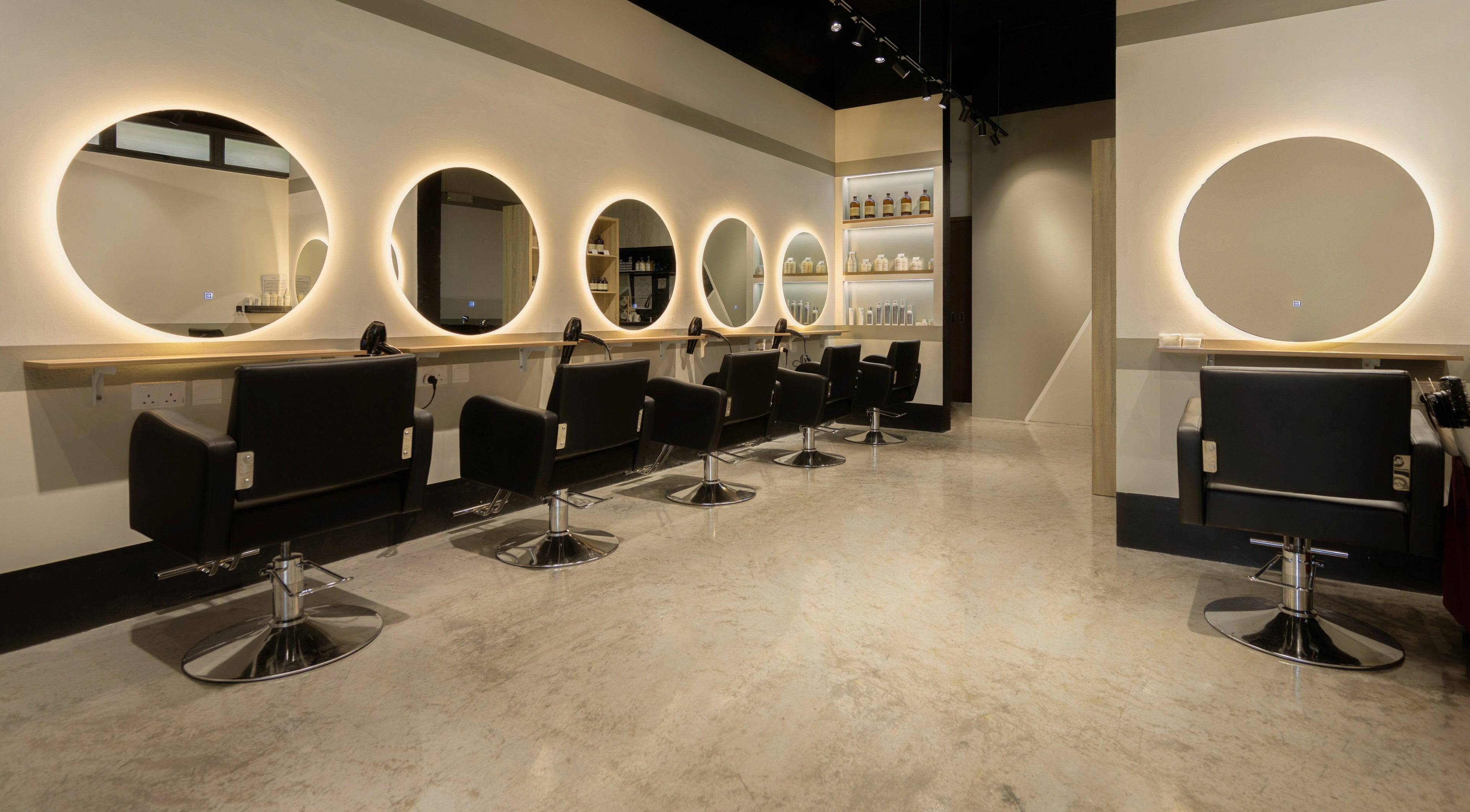 Modern salon chairs and mirrors at Hair by Common Studio - Queenstown, Singapore, Singapore, SG.