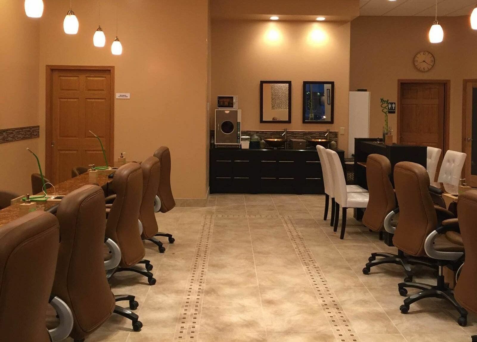 Comfortable seating and serene lighting at Evol Nails and Spa, St. Cloud, Minnesota, US.