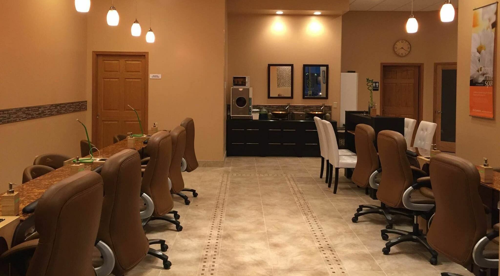 Comfortable seating and serene lighting at Evol Nails and Spa, St. Cloud, Minnesota, US.
