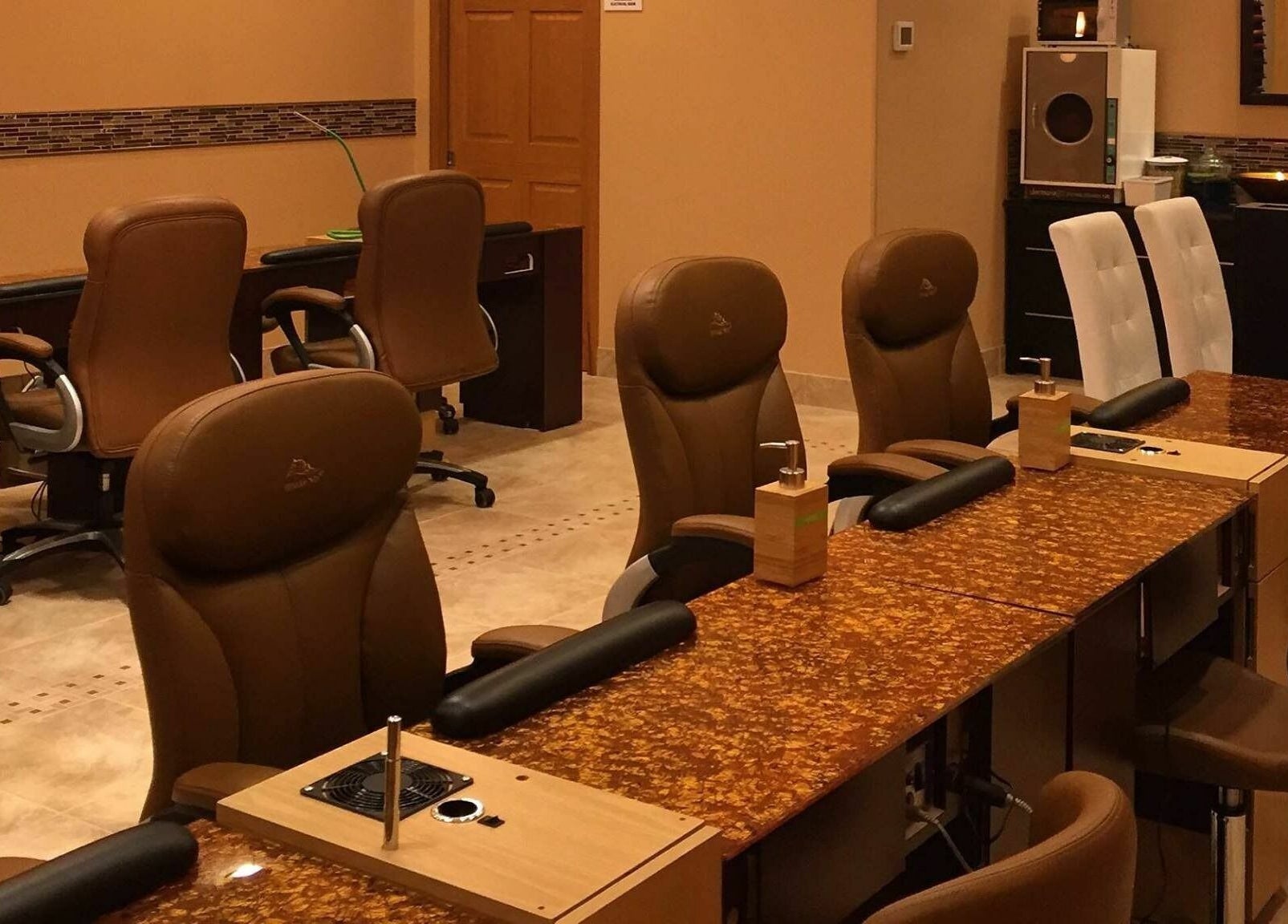 Elegant manicure stations at Evol Nails and Spa in St. Cloud, Minnesota, US offering a serene spa experience.