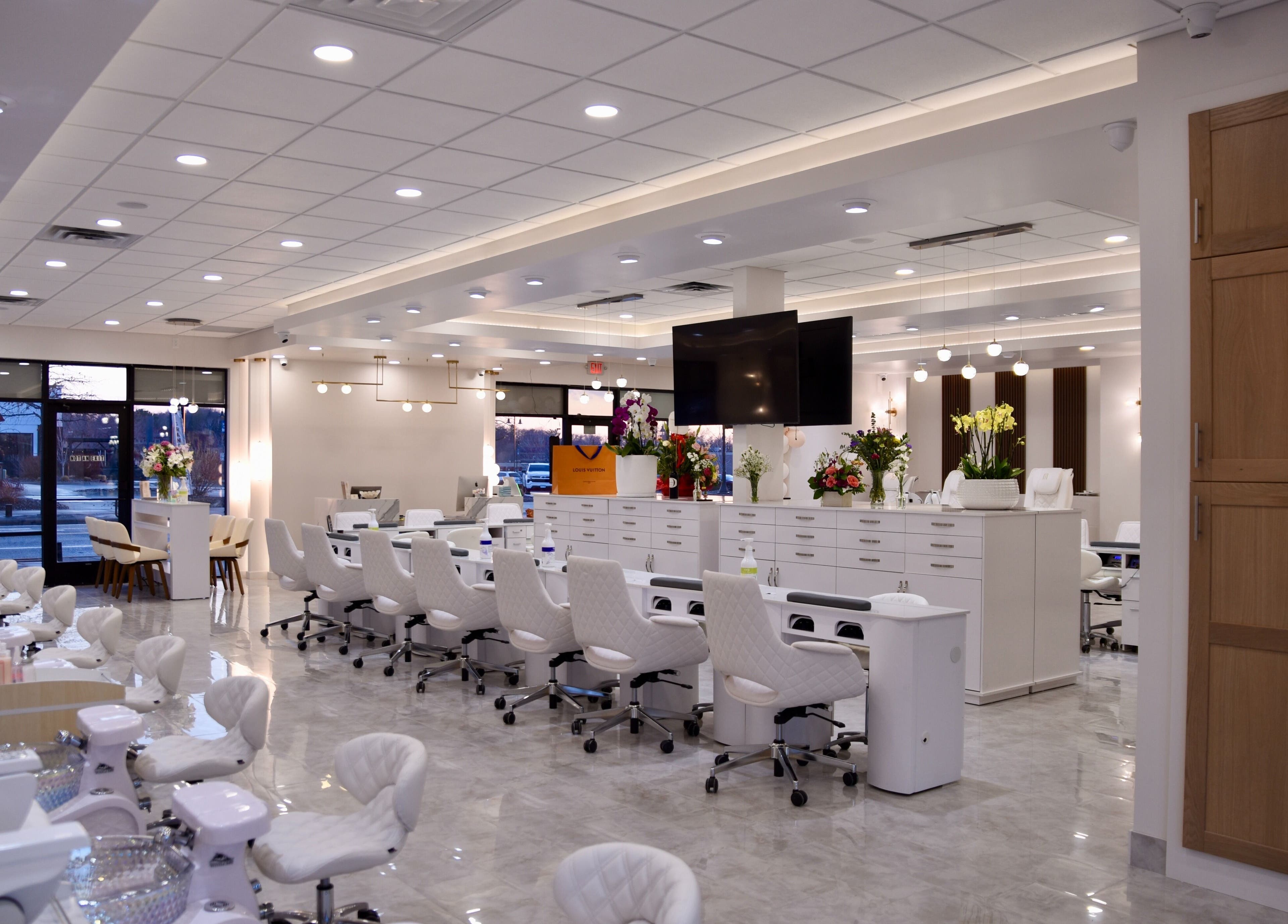 Modern interior of NT Nail Lab in Sauk Rapids, Minnesota, US featuring elegant manicure and pedicure stations.