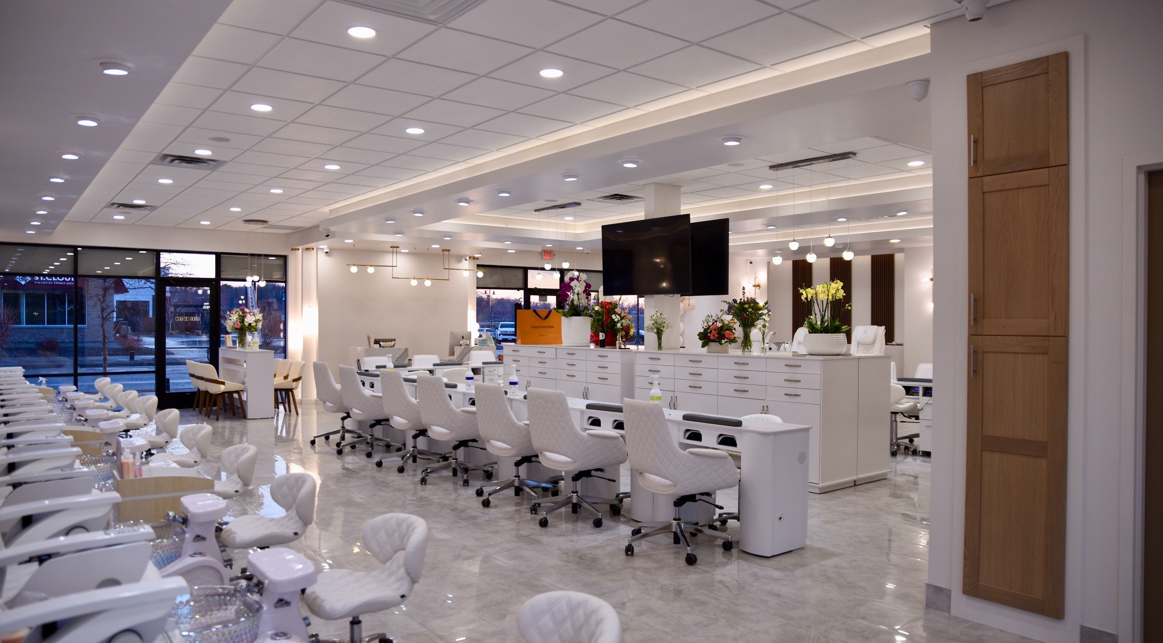 Modern interior of NT Nail Lab in Sauk Rapids, Minnesota, US featuring elegant manicure and pedicure stations.